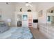 Spacious main bedroom with vaulted ceilings, ceiling fan, dresser, and ensuite bathroom at 2438 Sweetwater Club Cir # 50, Kissimmee, FL 34746