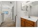 Bathroom featuring a wooden vanity and a mirror with medicine cabinet on the upper level at 2620 Lodi Cir # 103, Kissimmee, FL 34746