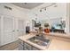 Bright kitchen featuring a stainless steel sink, and an open floor plan layout at 2620 Lodi Cir # 103, Kissimmee, FL 34746