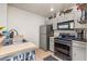 Functional kitchen with stainless steel appliances, ample cabinetry, and neutral countertops at 2620 Lodi Cir # 103, Kissimmee, FL 34746