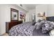 Well-decorated bedroom with a plush queen bed, wooden dresser, and entertainment center at 2620 Lodi Cir # 103, Kissimmee, FL 34746