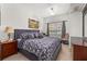 Comfortable bedroom with a queen bed, soft textures, and a large window at 2620 Lodi Cir # 103, Kissimmee, FL 34746