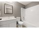 Clean bathroom featuring a shower-tub combo, white vanity with a mirror, and toilet at 265 Curtis Ave, Groveland, FL 34736