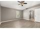 Bedroom with new flooring, a ceiling fan and natural light at 265 Curtis Ave, Groveland, FL 34736