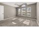 Bright and airy bedroom offers plush carpeting, and plenty of natural light at 265 Curtis Ave, Groveland, FL 34736