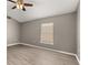 Bedroom with new flooring and natural light at 265 Curtis Ave, Groveland, FL 34736