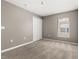 Neutral bedroom with carpeted floors and a closet at 265 Curtis Ave, Groveland, FL 34736