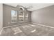 Spacious bedroom filled with natural light from large windows, plush carpet, and neutral walls at 265 Curtis Ave, Groveland, FL 34736