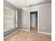 Neutral dining room with tiled floors and natural light from the window at 265 Curtis Ave, Groveland, FL 34736
