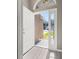 Bright entryway showcasing wood flooring and a welcoming view of the home's exterior at 265 Curtis Ave, Groveland, FL 34736