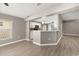 Open kitchen with breakfast bar and modern appliances at 265 Curtis Ave, Groveland, FL 34736