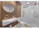 Sleek bathroom with gold fixtures, a modern vanity, and a frameless glass shower enclosure at 2715 Barclay Ln, Kissimmee, FL 34743