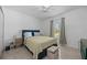 Comfortable bedroom featuring a queen-sized bed, decorative pillows, and a window with natural light at 2715 Barclay Ln, Kissimmee, FL 34743