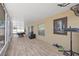 Spacious outdoor patio featuring tile flooring, workout equipment, and access to the backyard at 2715 Barclay Ln, Kissimmee, FL 34743