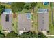 Birds eye view of the property with a screened in pool and putting green at 3125 Samosa Hill Cir, Clermont, FL 34714