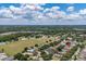Real estate aerial view showing a community in a desirable location, near green space at 3125 Samosa Hill Cir, Clermont, FL 34714