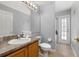 Bathroom featuring a vanity, toilet, walk-in shower, and tile flooring at 3125 Samosa Hill Cir, Clermont, FL 34714