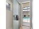Bright bathroom featuring a glass shower door and view of the inviting screened-in pool area at 3125 Samosa Hill Cir, Clermont, FL 34714