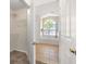 Bathroom featuring a tub, tile flooring and an adjoining closet at 3125 Samosa Hill Cir, Clermont, FL 34714