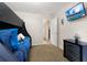 Nicely decorated bedroom featuring a bunk bed, wall-mounted TV, and doorway leading to other rooms at 3125 Samosa Hill Cir, Clermont, FL 34714