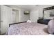 Bedroom featuring a bed with decorative pillows, closet, and wall-mounted television at 3125 Samosa Hill Cir, Clermont, FL 34714