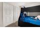 Nicely decorated bedroom featuring a bunk bed with built-in drawers and two closets at 3125 Samosa Hill Cir, Clermont, FL 34714