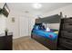 Nicely decorated bedroom with carpet, featuring a bunk bed with built-in drawers and a wall-mounted TV at 3125 Samosa Hill Cir, Clermont, FL 34714