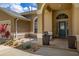 Cozy front porch with a bench and potted plants, creating a welcoming entrance to the home at 3125 Samosa Hill Cir, Clermont, FL 34714