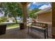 Inviting front porch featuring a 'Welcome' bench and potted plants, with a view of the neighborhood at 3125 Samosa Hill Cir, Clermont, FL 34714