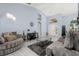 Bright and airy living room with vaulted ceilings, comfortable seating, and stylish decor creating a welcoming atmosphere at 3125 Samosa Hill Cir, Clermont, FL 34714