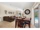 The living room is conveniently adjacent to the dining area and offers sliding glass door access to the lanai at 3125 Samosa Hill Cir, Clermont, FL 34714