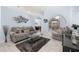 Inviting living room with comfortable seating, modern decor, and ample natural light creating a welcoming space at 3125 Samosa Hill Cir, Clermont, FL 34714