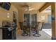 Covered outdoor patio featuring a grill, ceiling fan, and dining area with seating at 3125 Samosa Hill Cir, Clermont, FL 34714