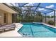 Inviting screened-in pool and spa surrounded by lush landscaping at 3125 Samosa Hill Cir, Clermont, FL 34714