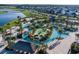 An aerial view showcases the community's lazy river, mini golf, and inviting amenities at 3150 Paradox Cir # 104, Kissimmee, FL 34746