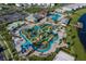An aerial view of the community pool and lazy river along with a mini golf area at 3150 Paradox Cir # 104, Kissimmee, FL 34746