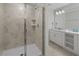 A bathroom featuring a glass enclosed shower and double vanity with tile flooring at 3150 Paradox Cir # 104, Kissimmee, FL 34746
