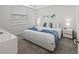 Bright bedroom features a king bed with plush bedding, complemented by modern nightstands and soft natural light at 3150 Paradox Cir # 104, Kissimmee, FL 34746