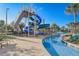 Resort-style pool area with a lazy river and towering water slide for endless summer fun at 3150 Paradox Cir # 104, Kissimmee, FL 34746