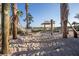 Community sand area featuring a hammock, lake view, and covered gazebo at 3150 Paradox Cir # 104, Kissimmee, FL 34746