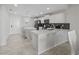 Bright kitchen with an eat-in island, stainless steel appliances, and modern lighting at 3150 Paradox Cir # 104, Kissimmee, FL 34746