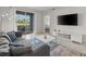 Living room with sliding glass door access to balcony, offering community views at 3150 Paradox Cir # 104, Kissimmee, FL 34746