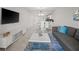 Spacious living room with modern decor and open layout to dining and kitchen areas at 3150 Paradox Cir # 104, Kissimmee, FL 34746
