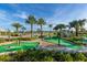A charming mini golf course with palm trees offers a fun and scenic recreational amenity at 3150 Paradox Cir # 104, Kissimmee, FL 34746