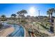 The community's lazy river flows past the manicured mini golf course, a tropical paradise at 3150 Paradox Cir # 104, Kissimmee, FL 34746