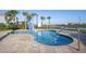 Relaxing community spa featuring a small pool and palm trees at 3150 Paradox Cir # 104, Kissimmee, FL 34746