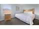 Inviting bedroom with a cozy bed, wooden furniture, and view from window at 321 Rosso Dr, Davenport, FL 33837