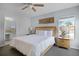 Comfortable bedroom with wooden headboard, tiled floor, and ensuite bathroom at 321 Rosso Dr, Davenport, FL 33837