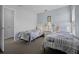 Bright bedroom with two twin beds with a nightstand in between, and closet at 321 Rosso Dr, Davenport, FL 33837