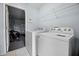 Laundry room with new washer and dryer next to the garage entrance at 321 Rosso Dr, Davenport, FL 33837